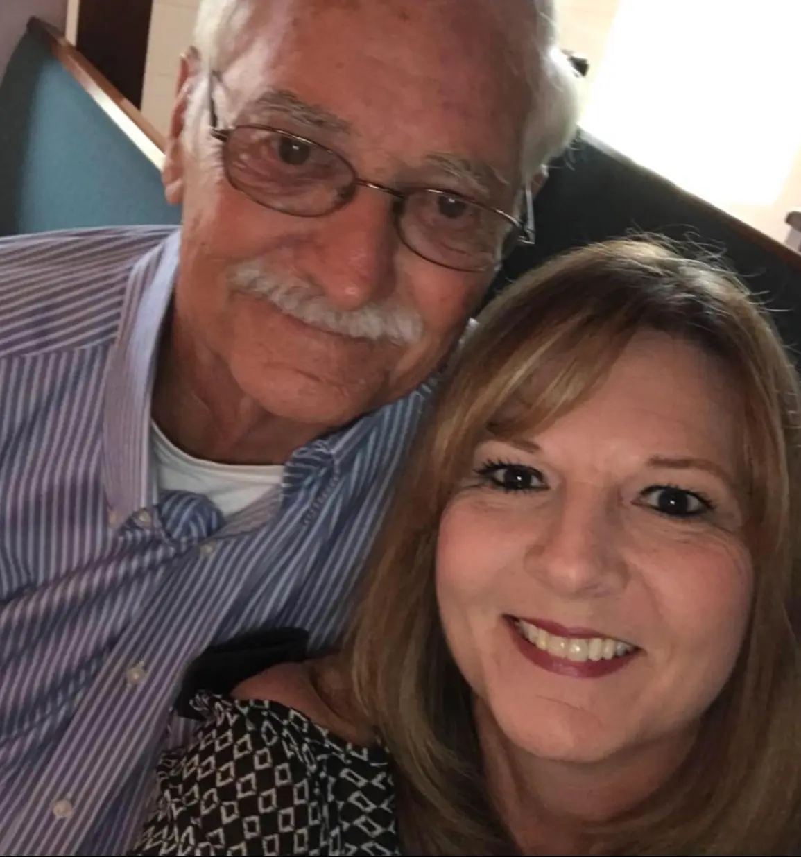 Deneen taking selfie with male client